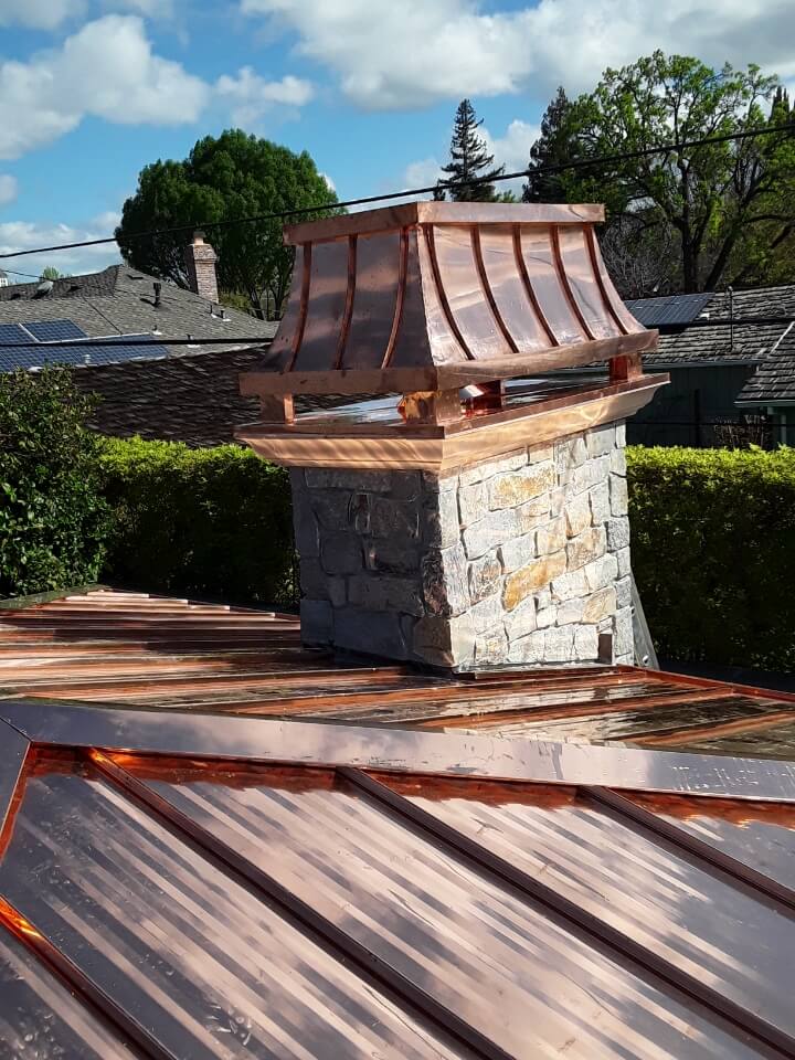 copper standing seam chimney top installed